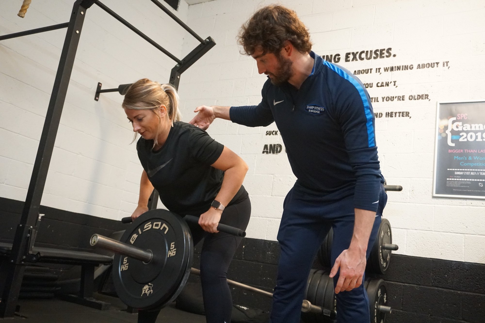 Matt Sharp coaching a client through a barbell row at Sussex Performance Centre, Worthing